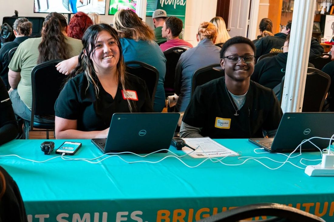 Bright Smiles volunteers talking with community members